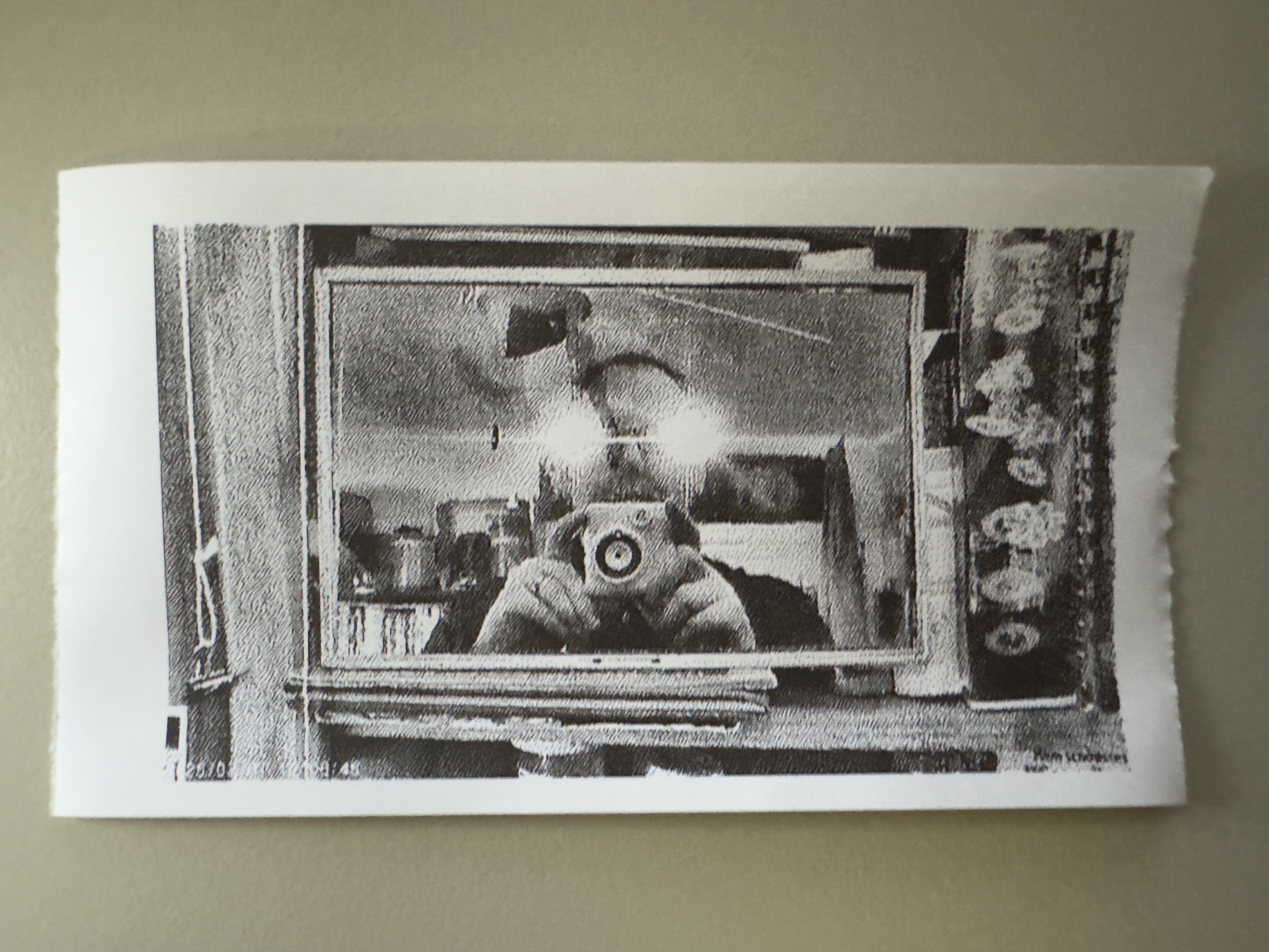 Self-portrait with white lens flares obscuring the eyes